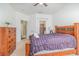 Comfortable bedroom with a ceiling fan, large window, ensuite bathroom, and a walk-in closet at 2717 Maitland Crossing # 207, Orlando, FL 32810