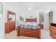 Comfortable bedroom with a ceiling fan, large windows and a walk-in closet at 2717 Maitland Crossing # 207, Orlando, FL 32810