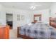 Comfortable bedroom with a ceiling fan, large windows, ensuite bathroom, and a walk-in closet at 2717 Maitland Crossing # 207, Orlando, FL 32810