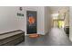 Condo entrance with a black door decorated with a festive fall wreath at 2717 Maitland Crossing # 207, Orlando, FL 32810