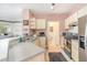 Kitchen showcases stainless steel appliances, ample storage, and breakfast bar at 2717 Maitland Crossing # 207, Orlando, FL 32810
