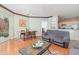 Living room and dining room area combo with wood floors and natural light at 2717 Maitland Crossing # 207, Orlando, FL 32810