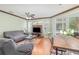 Spacious living room boasts wood floors, ceiling fan, and balcony access at 2717 Maitland Crossing # 207, Orlando, FL 32810