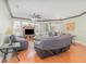 Living room featuring wood floors, sliding glass doors, and a ceiling fan at 2717 Maitland Crossing # 207, Orlando, FL 32810