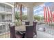 Relaxing outdoor patio with a table and chairs, offering a comfortable space for enjoying fresh air at 2717 Maitland Crossing # 207, Orlando, FL 32810
