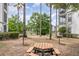 Community picnic area featuring a wooden picnic table near a pond at 2717 Maitland Crossing # 207, Orlando, FL 32810