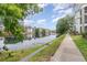 Scenic view of a community pond reflecting the surrounding buildings and trees at 2717 Maitland Crossing # 207, Orlando, FL 32810