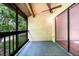 Relaxing screened balcony with ceiling fan, offering a peaceful outdoor retreat at 2924 S Semoran Blvd # D2, Orlando, FL 32822