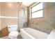This is a simple bathroom with neutral-colored tile and a shower-tub combo at 2924 S Semoran Blvd # D2, Orlando, FL 32822