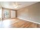 Bedroom with a neutral color scheme, ceiling fan, and laminate floors at 2924 S Semoran Blvd # D2, Orlando, FL 32822