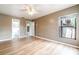 Bedroom with a neutral color scheme, ceiling fan, and laminate floors at 2924 S Semoran Blvd # D2, Orlando, FL 32822