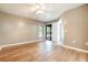 Neutral bedroom with laminate flooring, ceiling fan and access to screened porch at 2924 S Semoran Blvd # D2, Orlando, FL 32822