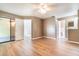 Large bedroom featuring wood-look floors, a ceiling fan, and multiple closets at 2924 S Semoran Blvd # D2, Orlando, FL 32822