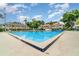 Community pool surrounded by lounge chairs and well-maintained landscaping at 2924 S Semoran Blvd # D2, Orlando, FL 32822