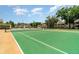 Well-maintained tennis court ready for a match, set in a community with lush landscaping at 2924 S Semoran Blvd # D2, Orlando, FL 32822
