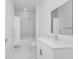 Modern bathroom featuring double vanity, modern fixtures, and a shower/tub combo with marble-style tile surround at 296 Famagusta Dr, Davenport, FL 33896