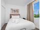 Comfortable bedroom featuring soft bedding and a sunny window allowing natural light at 296 Famagusta Dr, Davenport, FL 33896