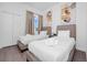 Cozy bedroom featuring two twin beds with comfortable bedding, closet, and sleek design at 296 Famagusta Dr, Davenport, FL 33896