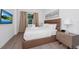 Bedroom with a comfortable bed, soft lighting, and large window at 296 Famagusta Dr, Davenport, FL 33896