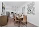 Refined dining area featuring a well-set table, modern pendant lights, and easy access to the adjacent kitchen at 296 Famagusta Dr, Davenport, FL 33896