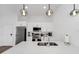 Bright kitchen with white countertops, stainless steel appliances, and modern fixtures at 296 Famagusta Dr, Davenport, FL 33896