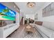 Stylish living room with an open-concept design, modern decor, and a staircase leading to the upper level at 296 Famagusta Dr, Davenport, FL 33896