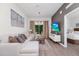 Comfortable living space featuring a large sofa, modern decor, and a smooth transition to the adjacent bedroom at 296 Famagusta Dr, Davenport, FL 33896