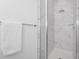 Elegant walk-in shower featuring marble tile, glass enclosure, and modern shower head at 296 Famagusta Dr, Davenport, FL 33896