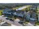 An aerial shot showcases the neighborhood, lake, landscaping and tree lined streets at 3310 Stonewyck St, Orlando, FL 32824