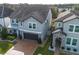 Two-story home featuring stone accents, a brick driveway, and manicured landscaping at 3310 Stonewyck St, Orlando, FL 32824