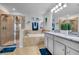 Bright and airy bathroom with double vanity, separate shower, and soaking tub at 3310 Stonewyck St, Orlando, FL 32824