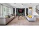 Stylish living room features modern decor, a fireplace, and large windows at 3310 Stonewyck St, Orlando, FL 32824