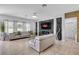 Spacious living room with modern furnishings, stone accent wall, and natural light at 3310 Stonewyck St, Orlando, FL 32824