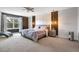 Spacious main bedroom with decorative accent wall, ceiling fan, and a large window at 3310 Stonewyck St, Orlando, FL 32824
