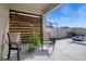 Outdoor seating area on patio with privacy screen, chairs and blue sky at 3310 Stonewyck St, Orlando, FL 32824