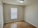 Cozy bedroom with tile flooring, a single window, neutral paint, and closet space at 404 S Salisbury Ave, Deland, FL 32720