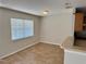 Dining area featuring tile flooring, natural light, and access to the kitchen, perfect for entertaining at 404 S Salisbury Ave, Deland, FL 32720