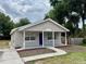 Charming single-story home with a welcoming front porch and fresh landscaping at 404 S Salisbury Ave, Deland, FL 32720