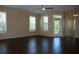Bright living room featuring modern ceiling fan, tile flooring, and a door leading to the balcony at 413 Summit Ridge Pl # 215, Longwood, FL 32779