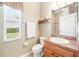 Bathroom featuring vanity, window, single sink and toilet at 432 Harbor Winds Ct, Winter Springs, FL 32708