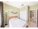 Comfortable bedroom featuring neutral carpet, built in closet, and soothing green walls at 432 Harbor Winds Ct, Winter Springs, FL 32708