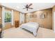Spacious bedroom featuring a ceiling fan, carpet flooring, and plenty of natural light from two windows at 432 Harbor Winds Ct, Winter Springs, FL 32708