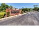 Entrance to Harbor Winds community, featuring a brick sign, manicured landscaping, and gated access at 432 Harbor Winds Ct, Winter Springs, FL 32708