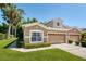 Charming townhouse with a well-manicured lawn, lush greenery, and inviting curb appeal at 432 Harbor Winds Ct, Winter Springs, FL 32708