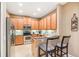 Modern kitchen featuring stainless steel appliances, stylish cabinets, and breakfast bar at 432 Harbor Winds Ct, Winter Springs, FL 32708