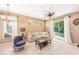 Cozy living room with tile floors, ceiling fan, comfortable seating, and natural light at 432 Harbor Winds Ct, Winter Springs, FL 32708
