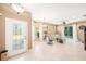 Bright and airy living room featuring tile floors, neutral colors, and sliding doors to the backyard at 432 Harbor Winds Ct, Winter Springs, FL 32708