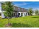 Home exterior highlighting the screened porch, manicured backyard, and neat landscaping at 4353 Campsite Loop, Orlando, FL 32824
