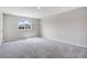 Bright bedroom with neutral walls and carpet offers a serene retreat with a window view at 4353 Campsite Loop, Orlando, FL 32824