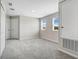 Expansive bonus room with plush carpeting and lots of windows, perfect for flexible living at 4353 Campsite Loop, Orlando, FL 32824